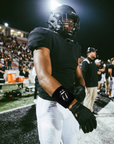 Player wearing the Black & Black RS Wristband under stadium lights