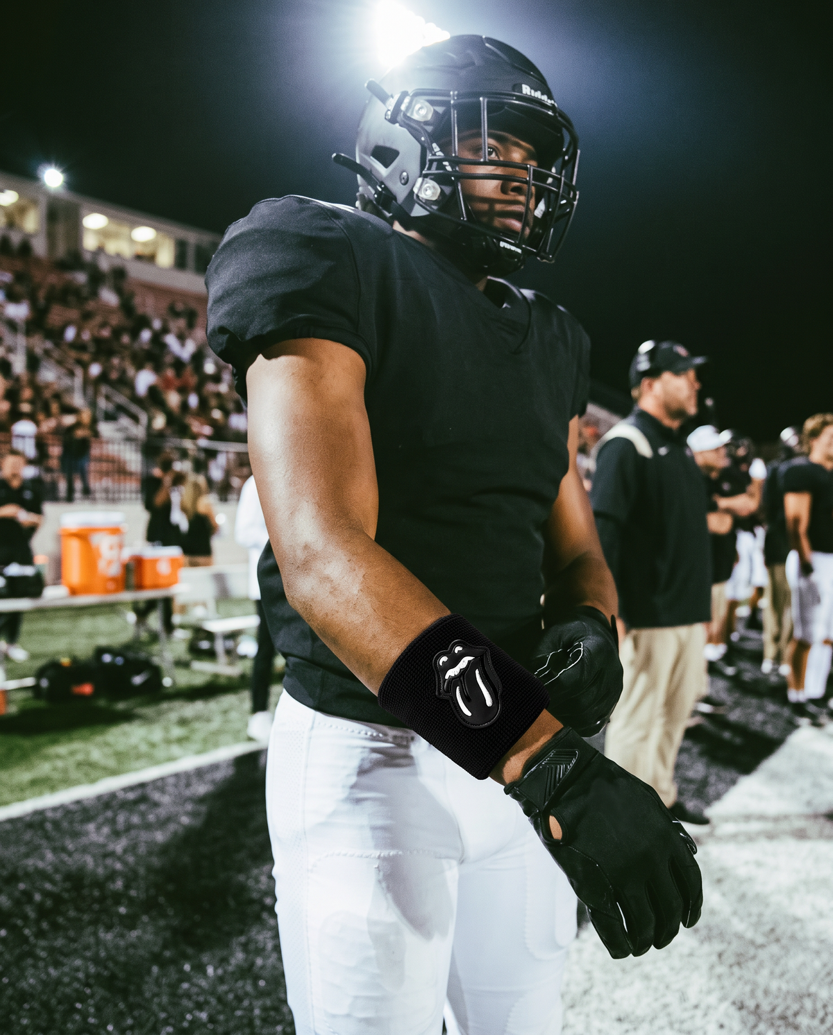 Player wearing the Black &amp; Black RS Wristband under stadium lights