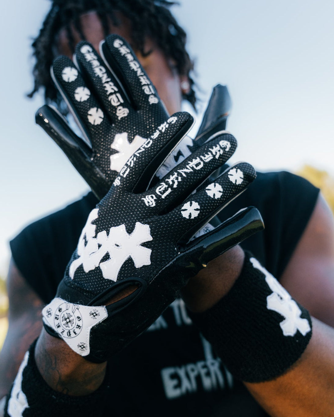 Model wearing the Black & White TriCross Wristband