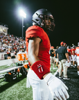 Player wearing the Red on Red RS Wristband under stadium lights