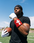 Player wearing the Red & White Cross Wristband on the field
