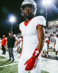 Player wearing the Red & White Cross Wristband under stadium lights
