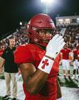 Player wearing the White & Red Cross Wristband under stadium lights